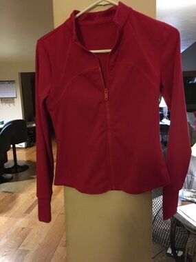 Bright red nylon and spandex lightweight zipper jacket. Small